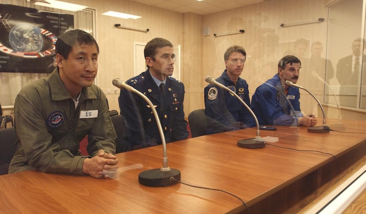 Astronaut Edward T. Lu, NASA International Space Station science officer and flight engineer for Expedition 7, left, cosmonaut Yuri I. Malenchenko, Expedition 7 commander, backup crew for Expedition 7 astronaut Michael Foale and cosmonaut Alexander Kaleri, right, attend a press conference, Thursday April 10, 2003, at the Baikonur Cosmodrome in Kazakhstan.