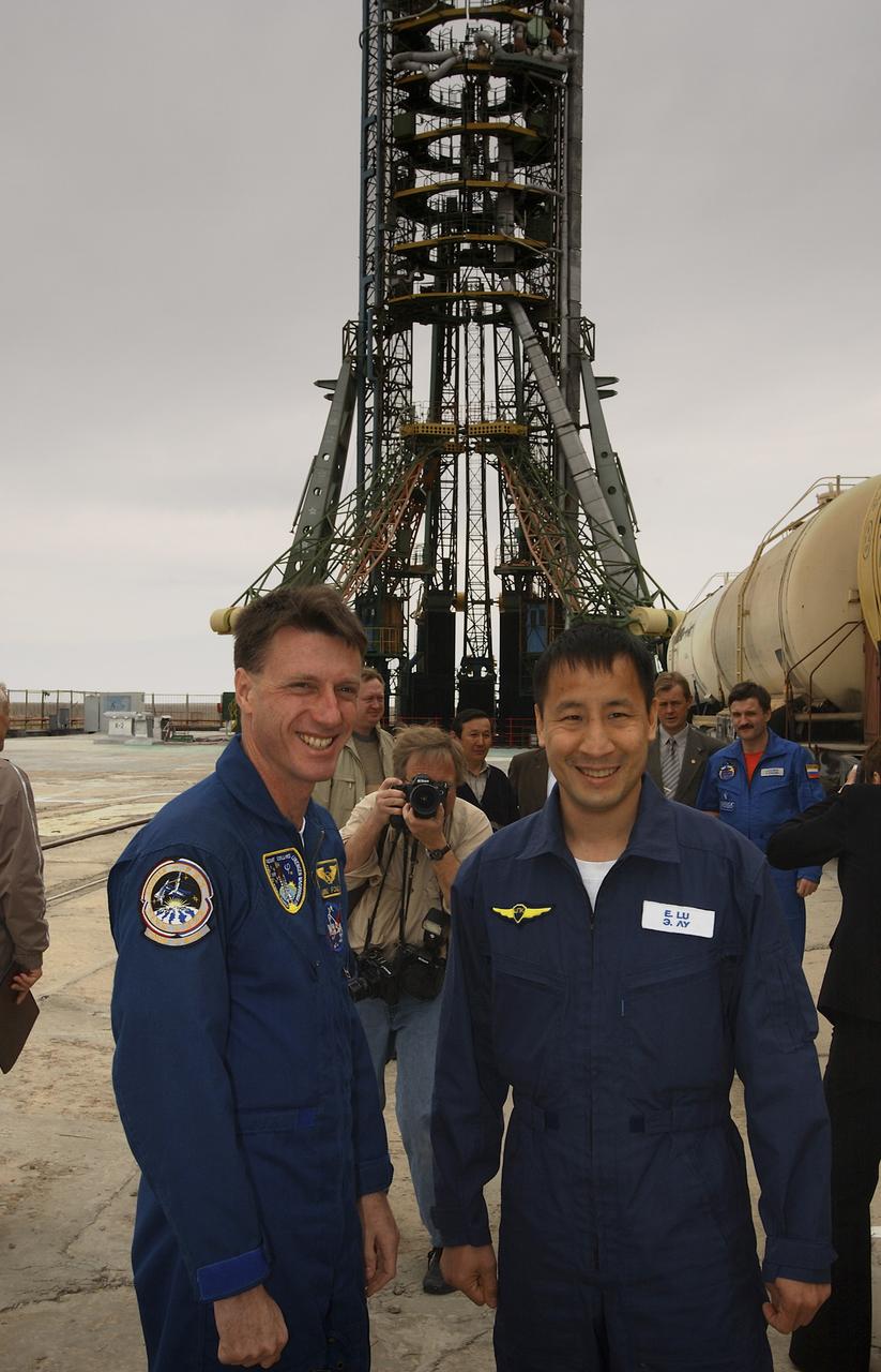 Expedition 7 backup crew member Michael Foale, left and NASA International Space Station Science Officer and Flight Engineer Edward T. Lu, along with their Russian cosmonaut crew members (out of frame), tour the Soyuz launch pad at the Baikonur Cosmodrome in Baikonur, Kazakhstan, Tuesday, April 22, 2003. The crew visited the pad prior to their scheduled launch on Saturday, April 26, 2003. Photo credit: (NASA/Bill Ingalls)