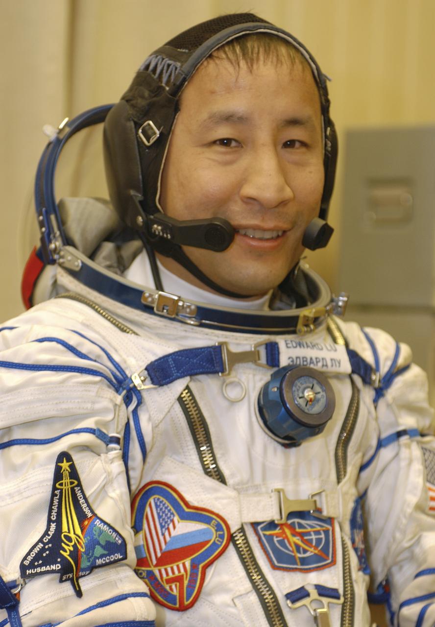 Edward T. Lu, Expedition 7 NASA International Space Station Science Officer and Flight Engineer, wearing his Russian Sokol suit, is pictured prior to his launch with Commander Yuri I. Malenchenko aboard the Soyuz rocket at 9:53 am from Baikonur, Kazakhstan, Saturday, April 26, 2003. Photo credit: (NASA/Bill Ingalls)