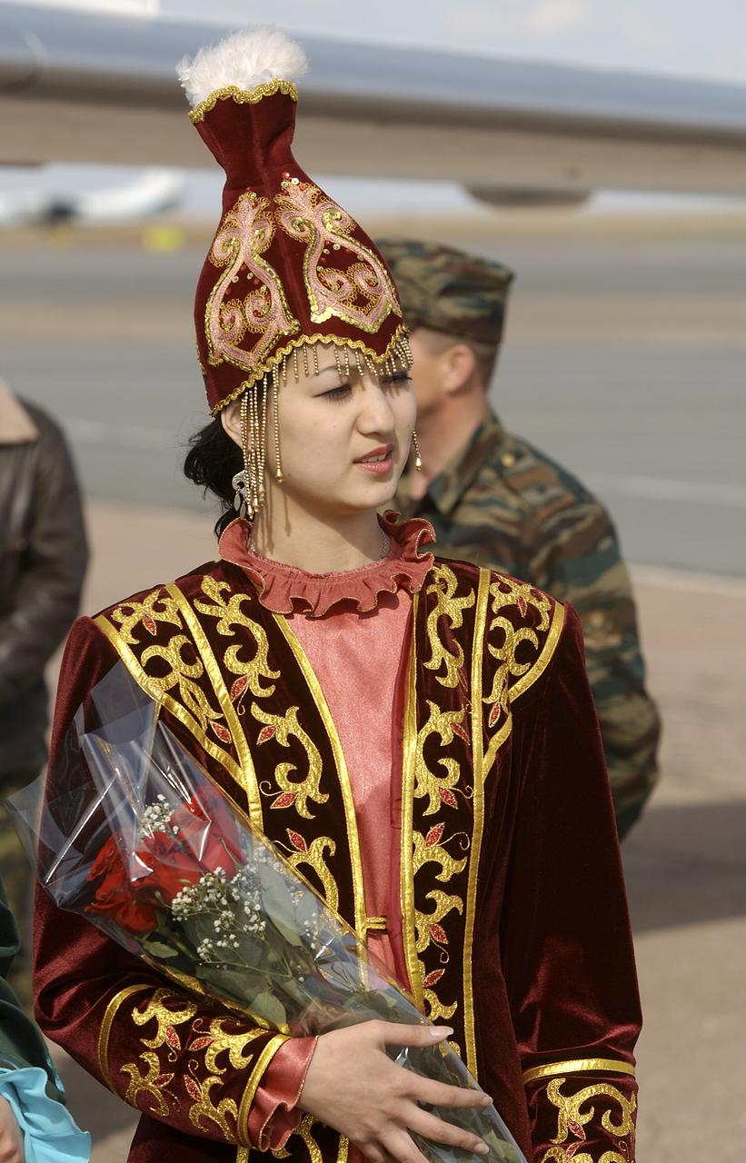 One of three local Kazakh girls who were on hand at the International Airport Astana to welcome the Expedition 6 crew with roses after the crew landed on the Kazakh steppe in their Soyuz capsule, Tuesday, May 4, 2003 in Astana, Kazakhstan.  Photo Credit: (NASA/Bill Ingalls)