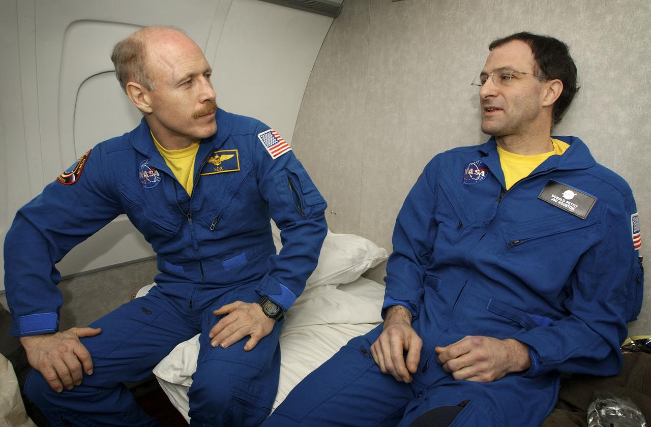 Expedition 6 Commander Ken Bowersox, left and NASA Internationl Space Station Science Officer Don Pettit talk about their landing during the flight from Kazakhstan to Moscow, Tuesday, May 4, 2003.   Photo Credit: (NASA/Bill Ingalls)