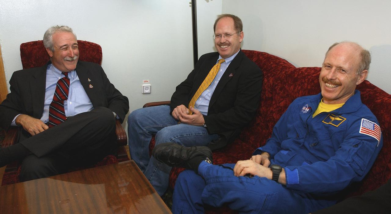 NASA Administrator Sean O'Keefe, left, visits with Expedition 6 Commander Ken Bowersox, far right and his brother on Tuesday, May 4, 2003, in Star City, Russia.  Photo Credit: (NASA/Bill Ingalls)
