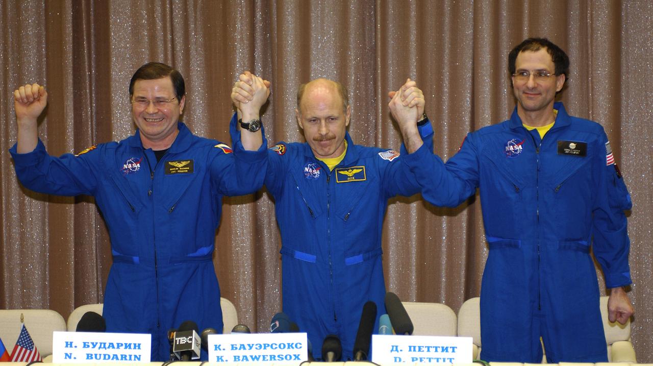Expedition 6 Flight Engineer Nikolai Budarin, left, Commander Ken Bowersox and International Space Station Science Officer Don Pettit, right, pose for photos at a press conference at the Gagarin Cosmonaut Training Center in Star City, Russia, Thursday, May 6, 2003. Photo Credit: (NASA/Bill Ingalls)