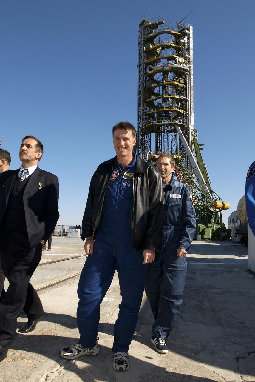 Expedition 8 Commander and NASA Science Officer Michael Foale, center, visits the launch pad at the Baikonur Cosmodrome in Kazakhstan, Monday, Oct. 13, 2003 during final prelaunch preparations. Foale, launched from this pad to the International Space Station on Oct. 18, 2003. Photo Credit (NASA/Bill Ingalls)