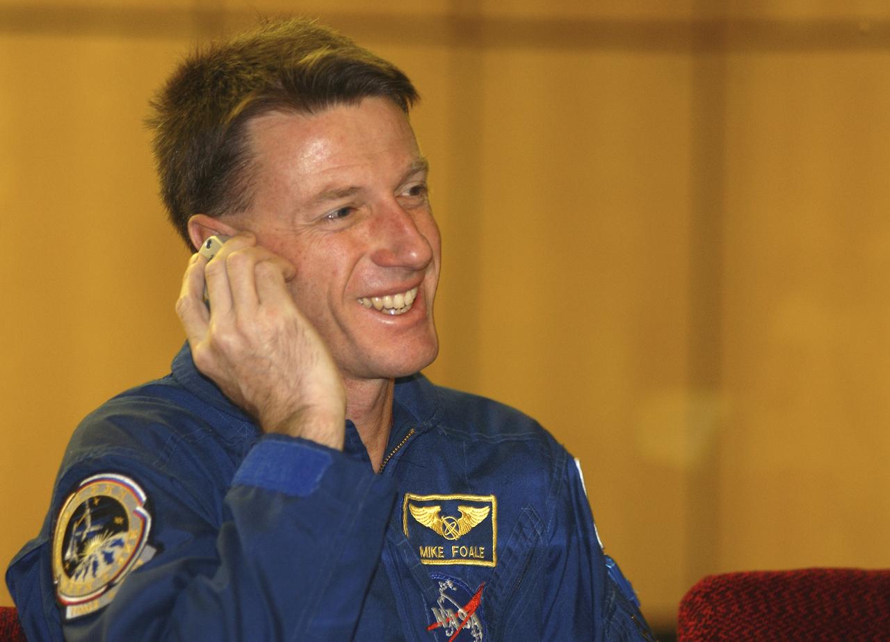 Expedition 8 Commander and NASA Science Officer Michael Foale talks to a colleague on his cell phone from his crew quarters at the Cosmonaut Hotel in Baikonur, Kazakhstan, Wednesday, Oct. 15, 2003. Foale along with Expedition 8 Soyuz Commander Alexander Kaleri and European Space Agency astronaut Pedro Duuque of Spain, launched on a Soyuz TMA-3 vehicle to the International Space Station. Photo Credit (NASA/Bill Ingalls)