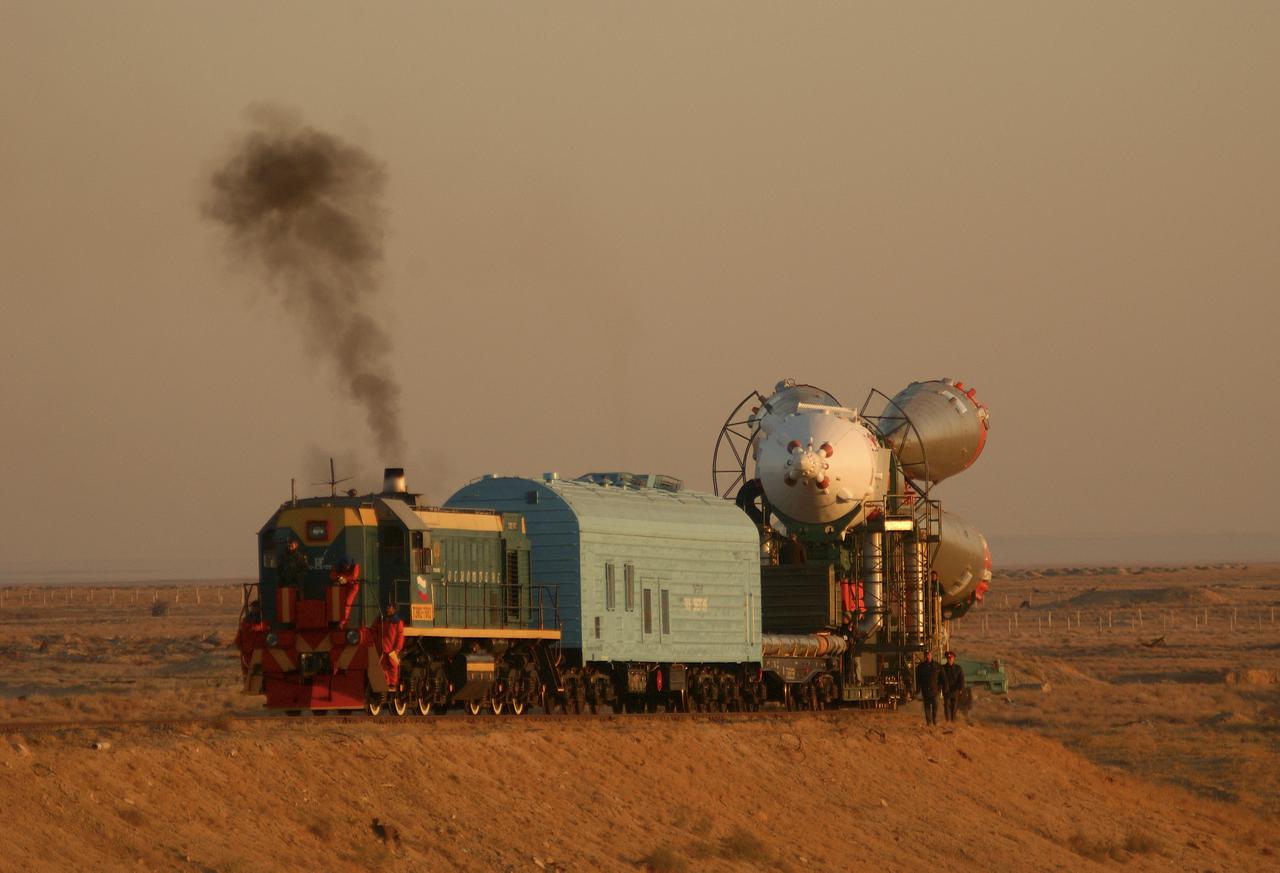 A Soyuz TMA-3 spacecraft and its booster rocket is transported on a rail car to the launch pad at the Baikonur Cosmodrome, Kazakhstan on Thursday, Oct. 16, 2003 in preparation for liftoff Oct. 18 to carry Expedition 8 Commander and NASA Science Officer Michael Foale, Expedition 8 Soyuz Commander Alexander Kaleri and European Space Agency astronaut Pedro Duque of Spain to the International Space Station. Photo Credit (NASA/Bill Ingalls)