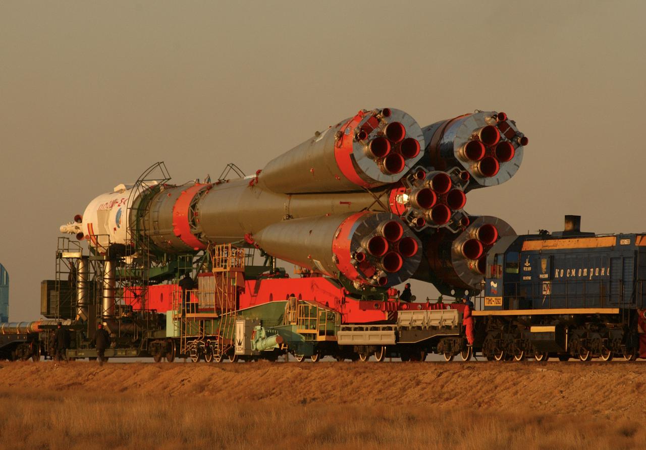 A Soyuz TMA-3 spacecraft and its booster rocket is transported on a rail car to the launch pad at the Baikonur Cosmodrome, Kazakhstan on Thursday, Oct. 16, 2003 in preparation for liftoff Oct. 18 to carry Expedition 8 Commander and NASA Science Officer Michael Foale, Expedition 8 Soyuz Commander Alexander Kaleri and European Space Agency astronaut Pedro Duque of Spain to the International Space Station. Photo Credit (NASA/Bill Ingalls)