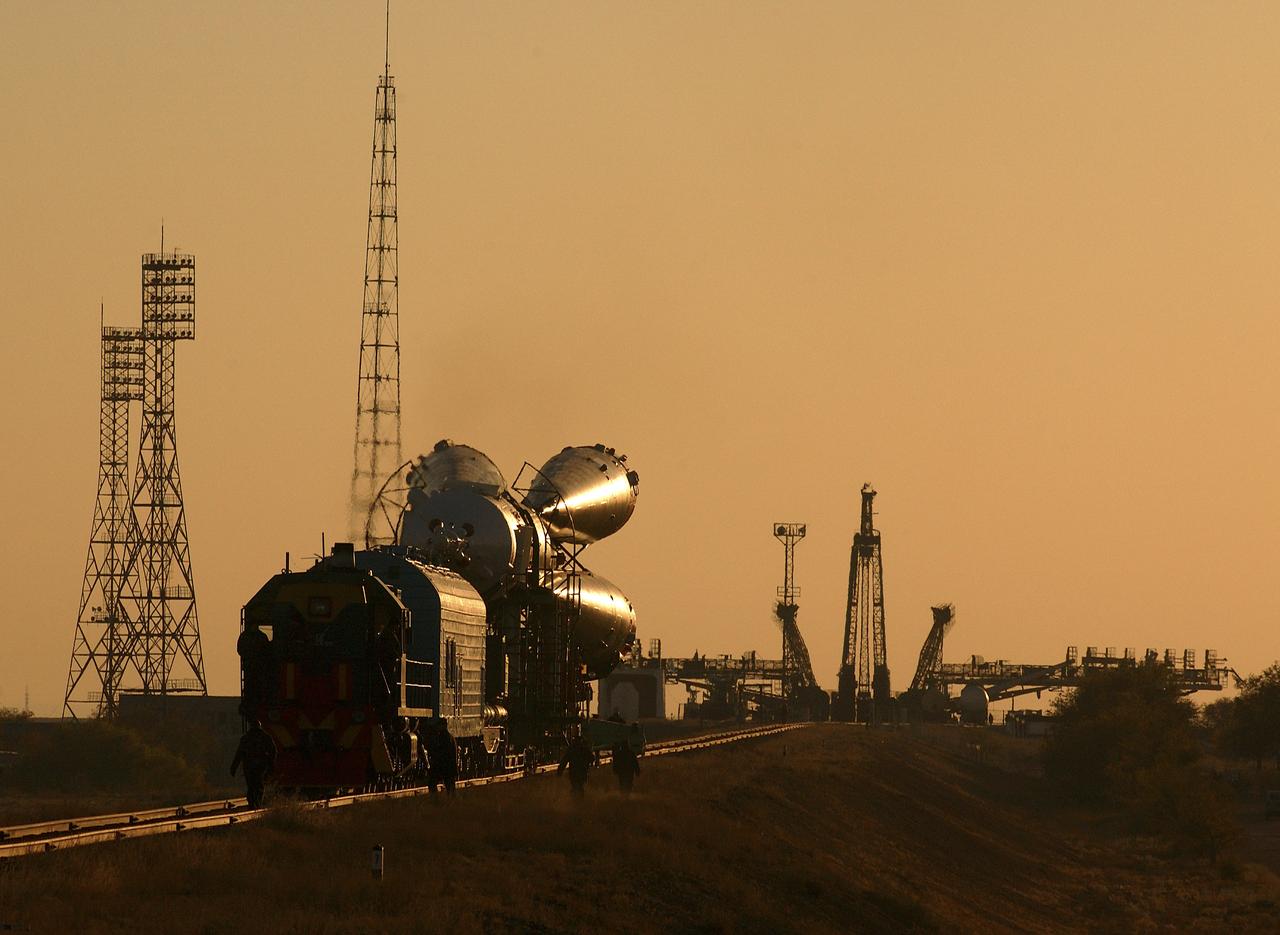 A Soyuz TMA-3 spacecraft and its booster rocket is transported on a rail car to the launch pad at the Baikonur Cosmodrome, Kazakhstan on Thursday, Oct. 16, 2003 in preparation for liftoff Oct. 18 to carry Expedition 8 Commander and NASA Science Officer Michael Foale, Expedition 8 Soyuz Commander Alexander Kaleri and European Space Agency astronaut Pedro Duque of Spain to the International Space Station. Photo Credit (NASA/Bill Ingalls)