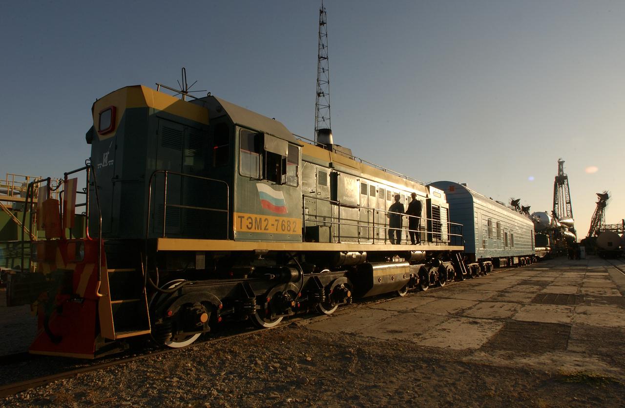 A Soyuz TMA-3 spacecraft and its booster rocket is seen, Thursday, Oct. 16, 2003, on a rail car near the launch pad at the Baikonur Cosmodrome, Kazakhstan during preparations for liftoff Oct. 18 to carry Expedition 8 Commander and NASA Science Officer Michael Foale, Expedition 8 Soyuz Commander Alexander Kaleri and European Space Agency astronaut Pedro Duque of Spain to the International Space Station. Photo Credit (NASA/Bill Ingalls)