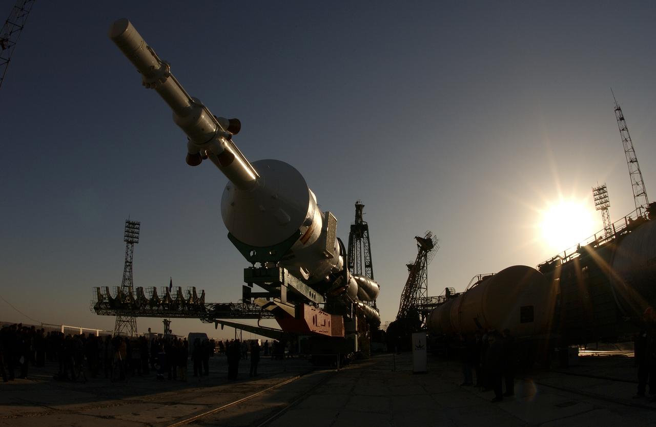 A Soyuz TMA-3 spacecraft and its booster rocket is seen, Thursday, Oct. 16, 2003, on a rail car near the launch pad at the Baikonur Cosmodrome, Kazakhstan during preparations for liftoff Oct. 18 to carry Expedition 8 Commander and NASA Science Officer Michael Foale, Expedition 8 Soyuz Commander Alexander Kaleri and European Space Agency astronaut Pedro Duque of Spain to the International Space Station. Photo Credit (NASA/Bill Ingalls)