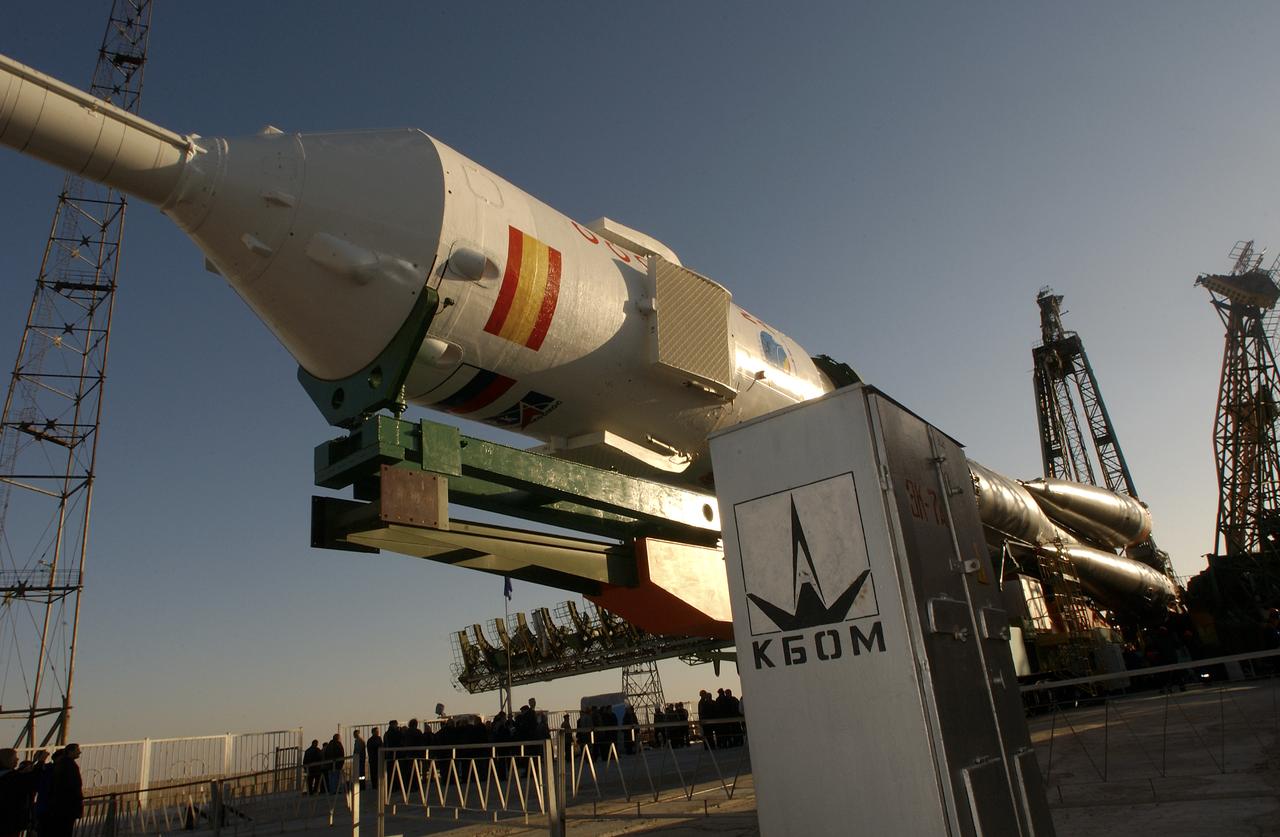 A Soyuz TMA-3 spacecraft and its booster rocket is seen, Thursday, Oct. 16, 2003, on a rail car near the launch pad at the Baikonur Cosmodrome, Kazakhstan during preparations for liftoff Oct. 18 to carry Expedition 8 Commander and NASA Science Officer Michael Foale, Expedition 8 Soyuz Commander Alexander Kaleri and European Space Agency astronaut Pedro Duque of Spain to the International Space Station. Photo Credit (NASA/Bill Ingalls)