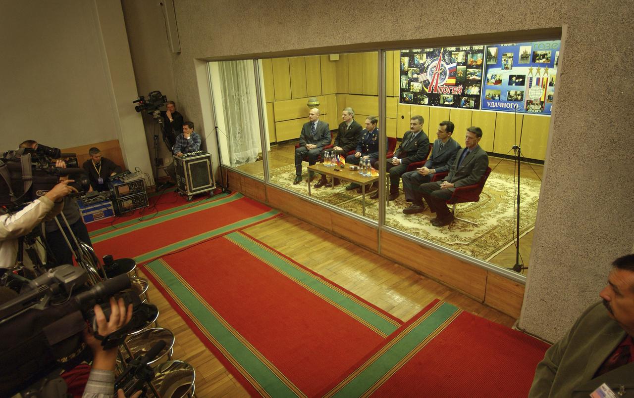 The prime and backups crews for the launch of the Russian Soyuz TMA-3 vehicle to the International Space Station listen to their certification for launch by a panel of Russian space officials in Baikonur, Kazakhstan Friday, Oct. 17, 2003, at the Cosmonaut Hotel. Baikonur, Kazakhstan. Expedition 8 Commander and NASA Science Officer Michael Foale, right, Expedition 8 Soyuz Commander Alexander Kaleri, third from right, and European Space Agency astronaut Pedro Duque of Spain launched Oct. 18, 2003, to the ISS. Photo Credit (NASA/Bill Ingalls)