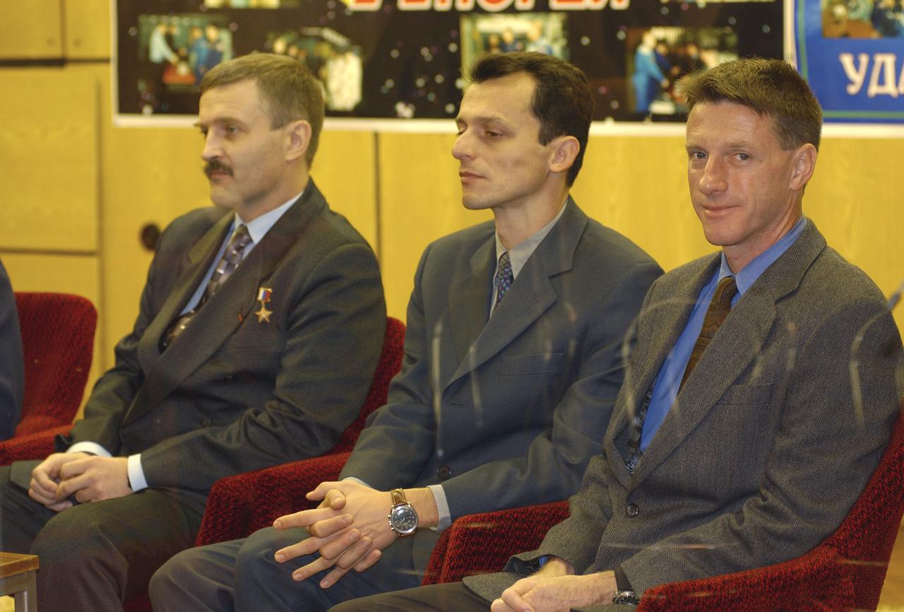 Expedition 8 Commander and NASA Science Officer Michael Foale, right, Expedition 8 Soyuz Commander Alexander Kaleri, left, and European Space Agency astronaut Pedro Duque of Spain, isten to their certification for launch by a panel of Russian space officials in Baikonur, Kazakhstan Friday, Oct. 17, 2003, at the Cosmonaut Hotel. Photo Credit (NASA/Bill Ingalls)