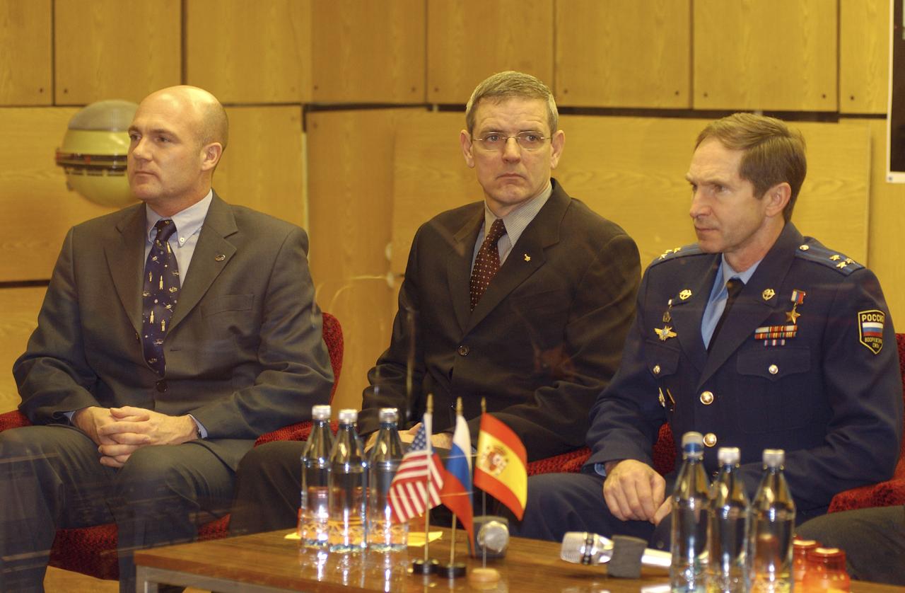 Backup crewmembers Andre Kuipers of the Netherlands of the European Space Agency, center, Bill McArthur of NASA, left, and Valery Tokarev of Russia listen to Russian space officials clear their Expedition 8 and European Space Agency prime crewmembers for launch during a State Commission meeting, Friday, Oct. 17, 2003, at the Cosmonaut Hotel in Baikonur, Kazakhstan. Prime crewmembers Mike Foale, Alexander Kaleri and Pedro Duque launched, Saturday, Oct. 18 to the International Space Station in a Soyuz TMA-3 vehicle.Photo Credit (NASA/Bill Ingalls)