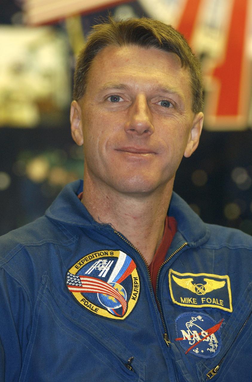 Expedition 8 Commander and NASA Science Officer Michael Foale listens to a reporter's question during a prelaunch news conference, Friday, Oct. 17, 2003, in Baikonur, Kazakhstan. Foale, Expedition 8 Soyuz Commander Alexander Kaleri and European Space Agency Astronaut Pedro Duque of Spain launched in a Soyuz TMA-3 vehicle Oct. 18 to the International Space Station. Photo Credit (NASA/Bill Ingalls)