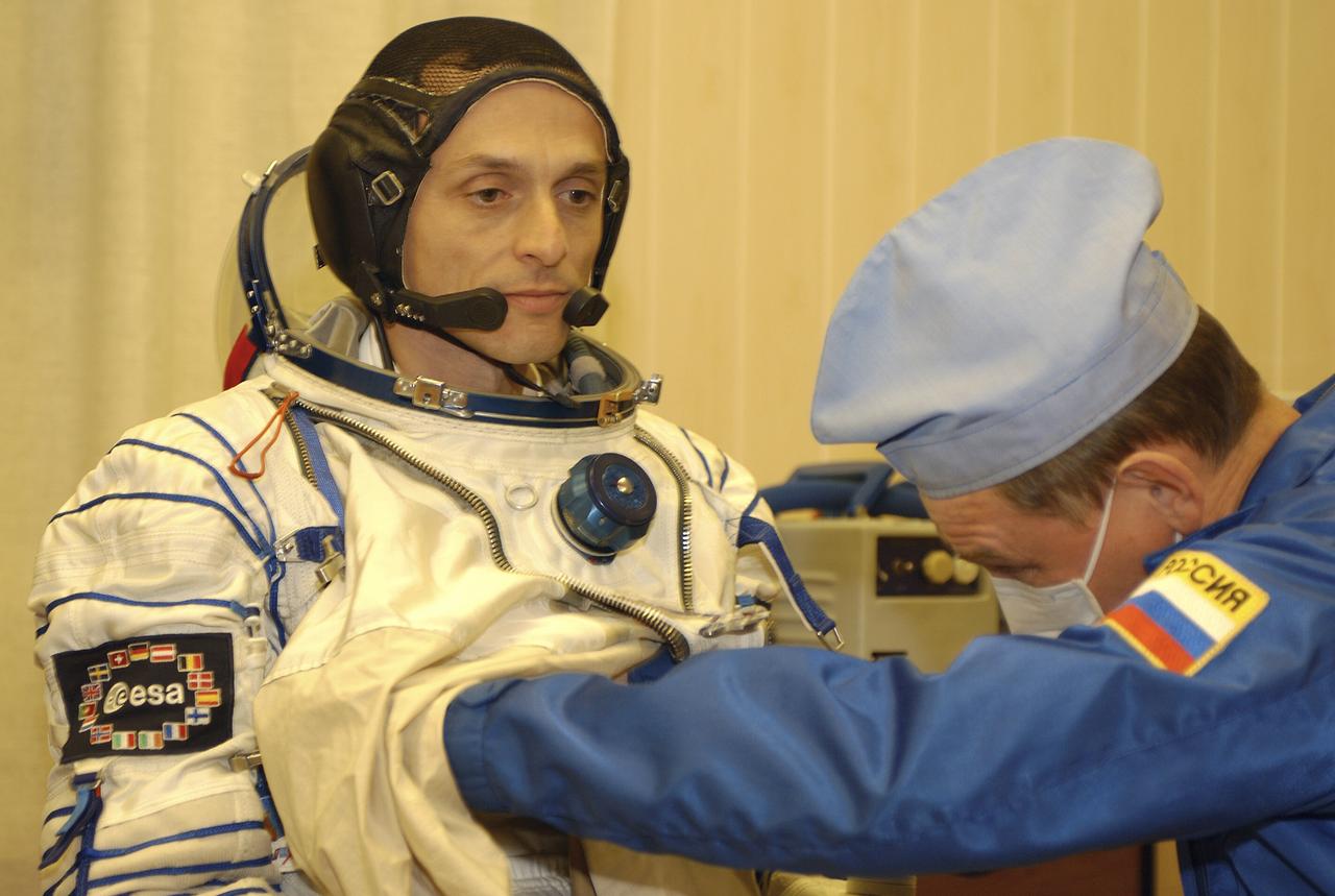 European Space Agency astronaut Pedro Duque of Spain suits up for launch, Saturday, Oct. 18, 2003, at the Baikonur Cosmodrome in Kazakhstan prior to his departure for the launch pad with Expedition 8 Commander and NASA Science Officer Mike Foale and Soyuz Commander Alexander Kaleri. The trio were launched on the Soyuz TMA-3 vehicle to the International Space Station, arriving on Oct. 20. Photo Credit (NASA/Bill Ingalls)