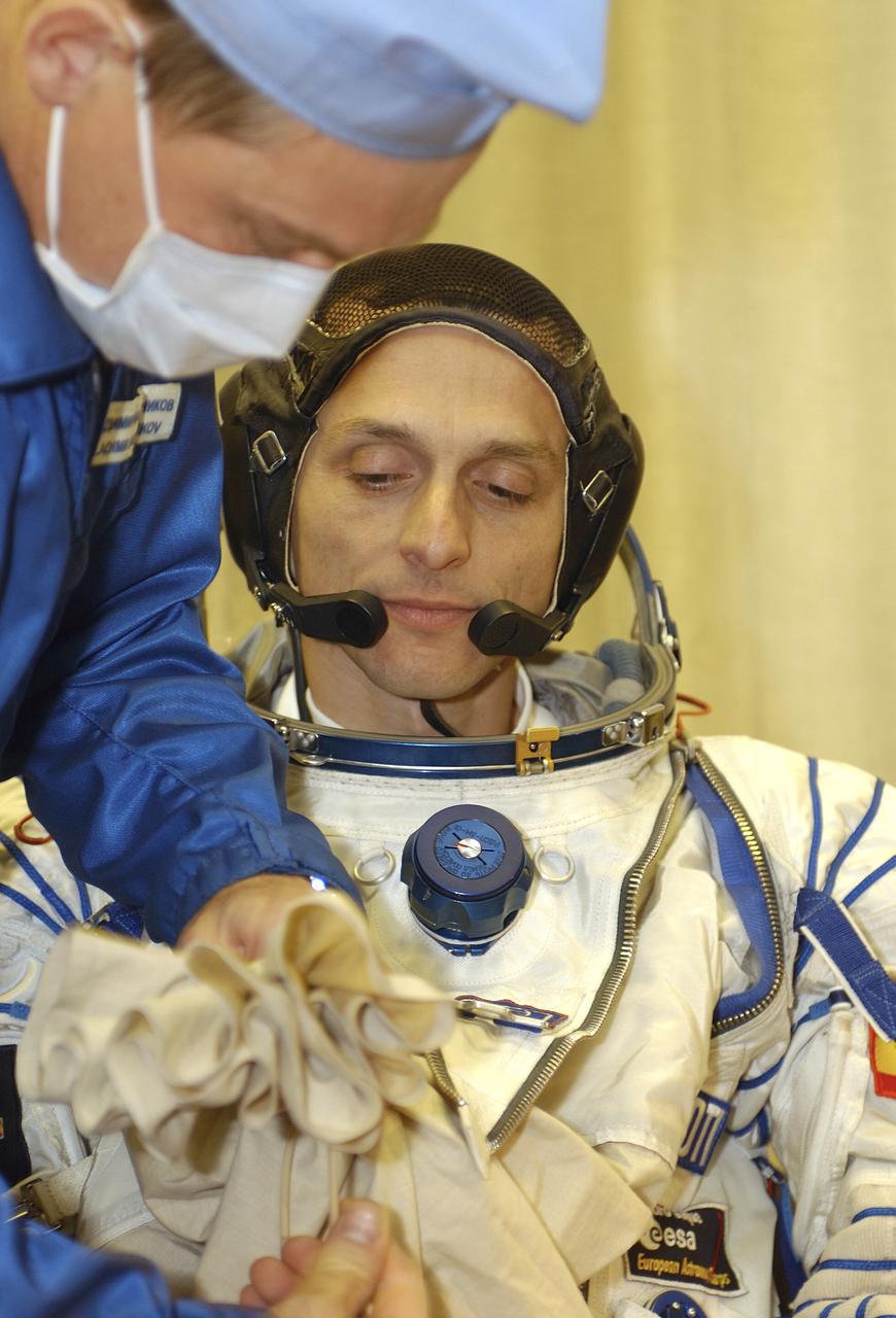 European Space Agency astronaut Pedro Duque of Spain suits up for launch, Saturday, Oct. 18, 2003, at the Baikonur Cosmodrome in Kazakhstan prior to his departure for the launch pad with Expedition 8 Commander and NASA Science Officer Mike Foale and Soyuz Commander Alexander Kaleri. The trio were launched on the Soyuz TMA-3 vehicle to the International Space Station, arriving on Oct. 20. Photo Credit (NASA/Bill Ingalls)