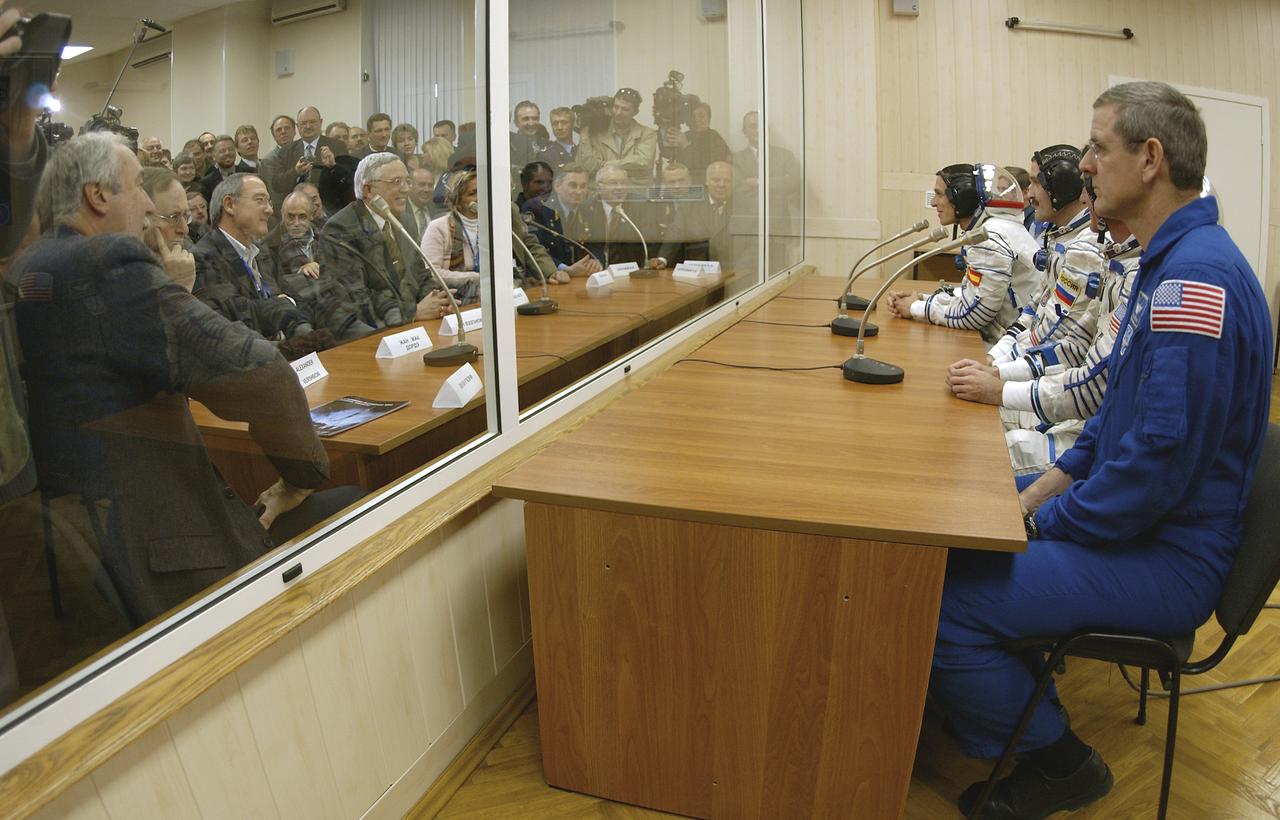 With NASA Administrator Sean O'Keefe, far left, looking on, the prime and backup crews for the Expedition 8 mission to the International Space Station and the prime and backup European Space Agency astronauts receive final well-wishes from Russian and U.S. space officials at the Baikonur Cosmodrome in Kazakhstan, Saturday, Oct. 18, 2003, before heading to the launch pad. Expedition 8 Commander and NASA Science Officer Mike Foale, Expedition 8 Soyuz Commander Alexander Kaleri and the ESA's Pedro Duque of Spain were launched on a Soyuz TMA-3 vehicle, arriving at the ISS on Oct. 20. Photo Credit (NASA/Bill Ingalls)