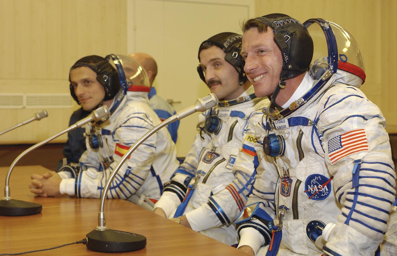 European Space Agency astronaut Pedro Duque of Spain, left, Expedition 8 Soyuz Commander Alexander Kaleri and Expedition 8 Commander and NASA Science Officer Michael Foale, right, receive final well wishes from Russian and U.S. officials at the Baikonur Cosmodrome in Kazakhstan, Saturday, Oct. 18, 2003, prior to their launch on a Soyuz TMA-3 vehicle to the International Space Station, arriving on Oct. 20. Photo Credit (NASA/Bill Ingalls)