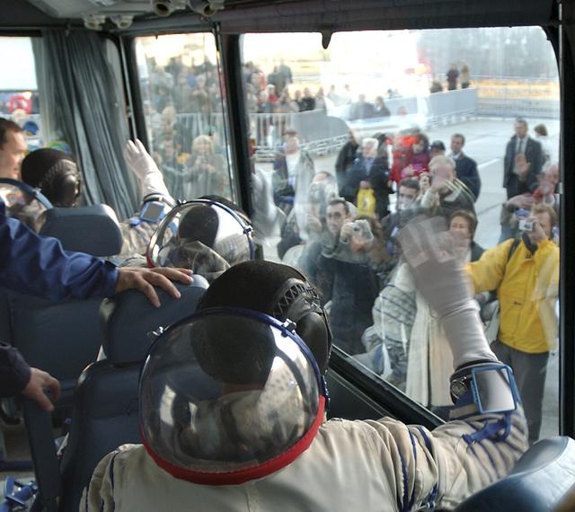 Expedition 8 Soyuz Commander Alexander Kaleri, front right, European Space Agency astronaut Pedro Duque of Spain and Expedition 8 Commander and NASA Science Officer Michael Foale, lower right, wave from a bus at the Baikonur Cosmodrome in Kazakhstan, Saturday, Oct. 18, 2003, before leaving to the launch pad for liftoff in a Soyuz TMA-3 vehicle to the International Space Station. The trio arrived at the ISS Oct. 20. Photo Credit (NASA/Bill Ingalls)
