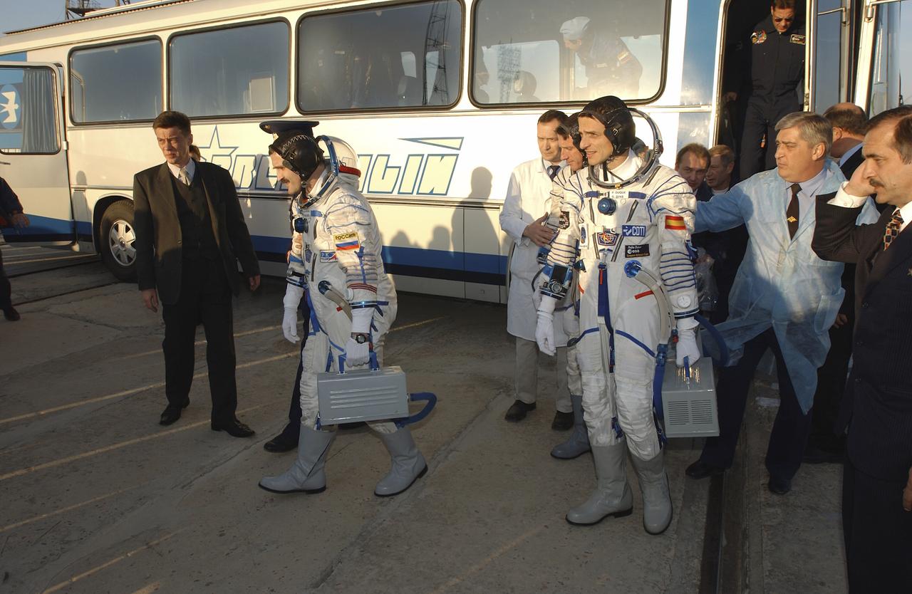 Expedition 8 crew members Alexander Kaleri, front left, Michael Foale along with European Space Agency astronaut Pedro Duque of Spain walk off the bus at the launch pad, Saturday, Oct. 18, 2003, to liftoff in a Soyuz TMA-3 vehicle to the International Space Station at the Baikonur Cosmodrome in Kazakhstan. Photo Credit (NASA/Bill Ingalls)