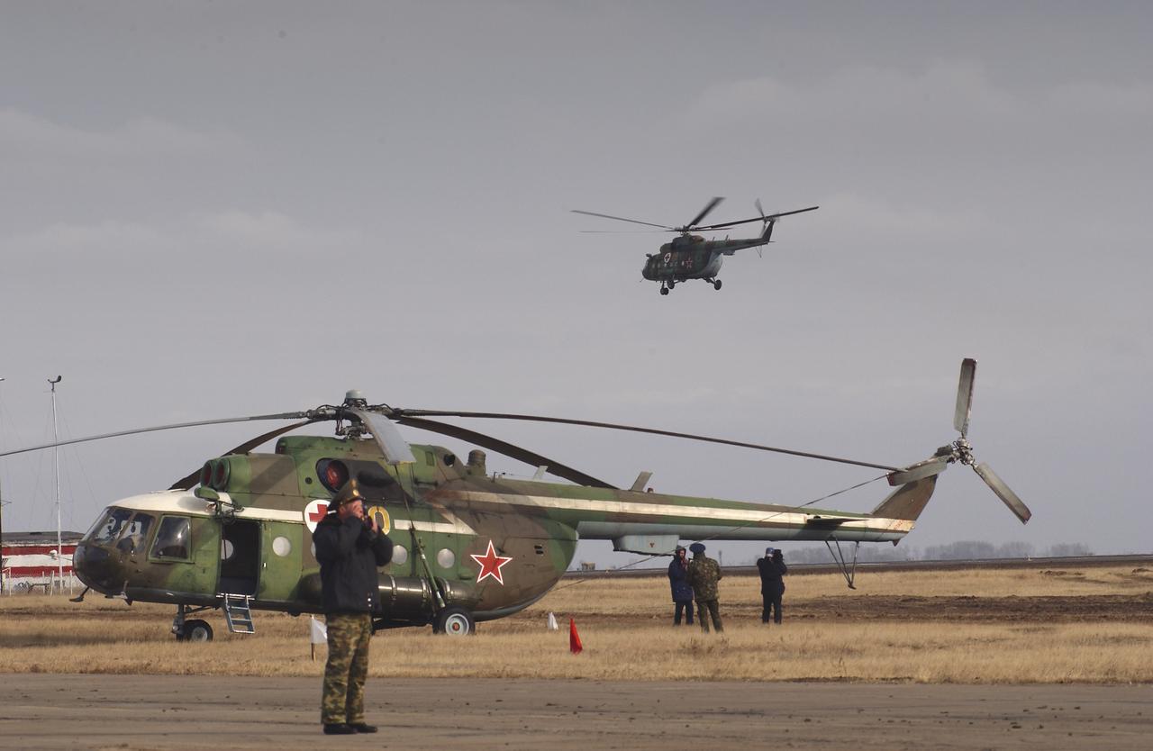 Four helicopters, representing Russian search and recovery forces, were advanced to Arkalyk, Kazakhstan a day prior to the Expedition 7 Soyuz landing, Monday, October 27, 2003. Photo Credit: (NASA/Bill Ingalls)