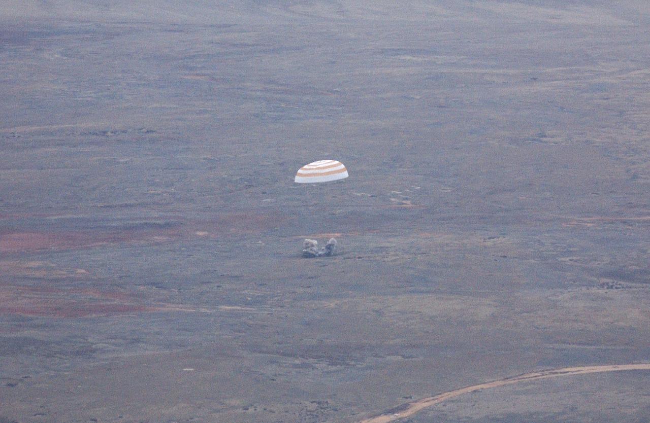 The Soyuz TMA-2 spacecraft carrying cosmonaut Yuri I. Malenchenko, Expedition 7 Mission Commander; astronaut Edward T. Lu, NASA International Space Station Science Officer and Flight Engineer; and European Space Agency (ESA) astronaut Pedro Duque of Spain lands in Kazakhstan on Monday, October 27, 2003 at 9:41 p.m. (EST). Photo Credit: (NASA/Bill Ingalls)