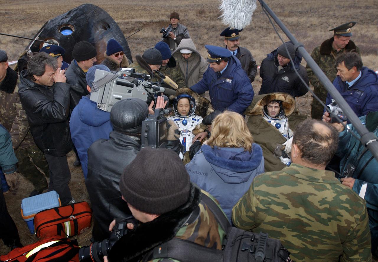 Astronaut Edward T. Lu, Expedition 7 NASA International Space Station Science Officer and Flight Engineer, left and cosmonaut Yuri I. Malenchenko, Mission Commander, are seated in their chairs after being extracted from the Soyuz TMA-2 spacecraft upon their landing in Kazakhstan on Monday, October 27, 2003 at 9:41 p.m. (EST). Photo Credit: (NASA/Bill Ingalls)