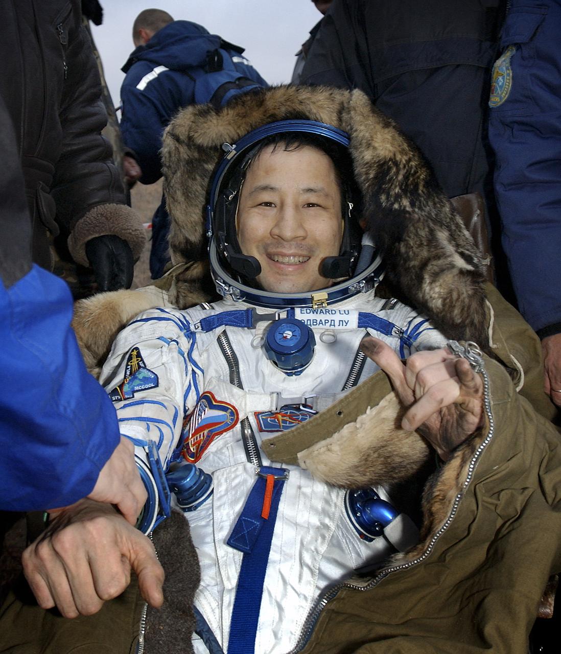 Edward T. Lu, Expedition 7 NASA International Space Station Science Officer and Flight Engineer, smiles while resting in a chair after landing in the Soyuz TMA-2 spacecraft in Kazakhstan on Monday, October 27, 2003 at 9:41 p.m. (EST). Photo Credit: (NASA/Bill Ingalls)