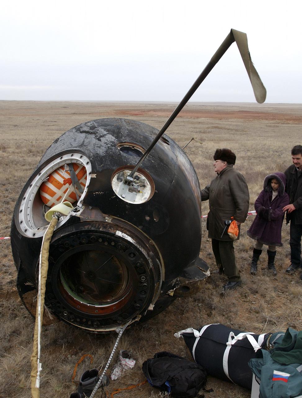 The Soyuz TMA-2 spacecraft carrying cosmonaut Yuri I. Malenchenko, Expedition 7 Mission Commander; astronaut Edward T. Lu, NASA International Space Station Science Officer and Flight Engineer; and European Space Agency (ESA) astronaut Pedro Duque of Spain is photographed on the ground after landing in Kazakhstan on Monday, October 27, 2003 at 9:41 p.m. (EST). Photo Credit: (NASA/Bill Ingalls)