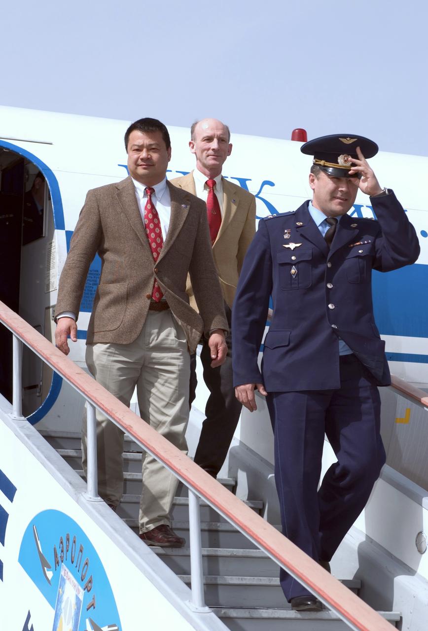 Backup Flight Engineer Salizhan Sharipov, front, NASA Expedition 9 backup commander Leroy Chiao, center and backup European Space Agency astronaut Gerhard Thiele, of Germany arrive at Baikonur, Kazakhstan, Tuesday, April 13, 2004, six days prior to the scheduled launch of Expedition 9 on a Soyuz rocket. Photo Credit: (NASA/Bill Ingalls)