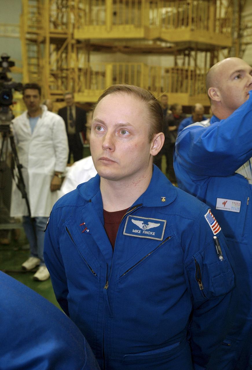Expedition 9 Science Officer and Flight Engineer Mike Fincke waits as his crew prepares to do their final Soyuz fit check at building 254 at the Baikonur Cosmodrome, Wednesday, April 14, 2004, in Baikonur, Kazakhstan. Photo Credit: (NASA/Bill Ingalls)