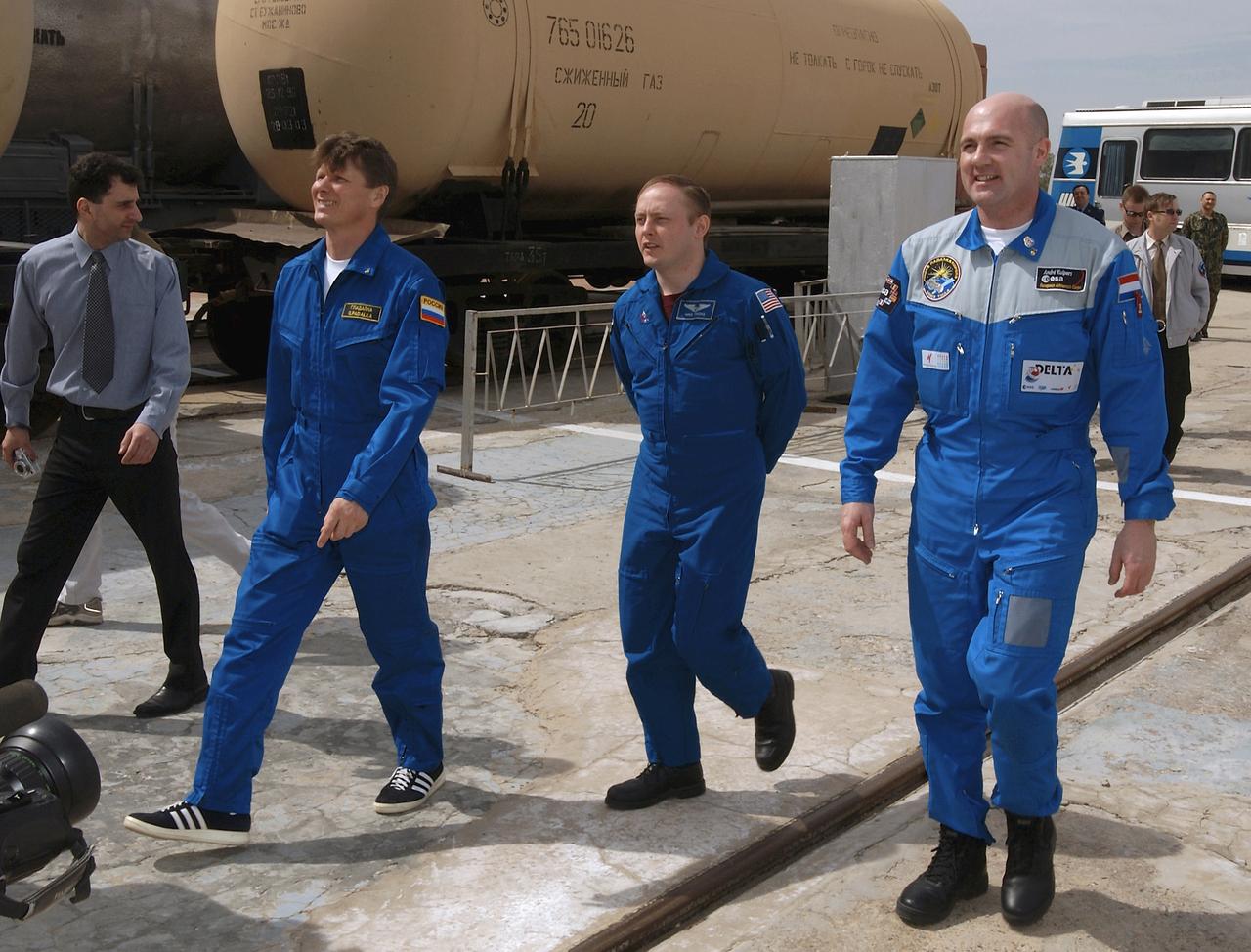 Expedition 9 Commander Gennady Padalka, Flight Engineer and NASA Science Officer Mike Fincke, center and European Space Agency astronaut Andre Kuipers of the Netherlands take a tour of the Soyuz launch pad, Wednesday, April 14, 2004, in Baikonur, Kazakhstan. Photo Credit: (NASA/Bill Ingalls)