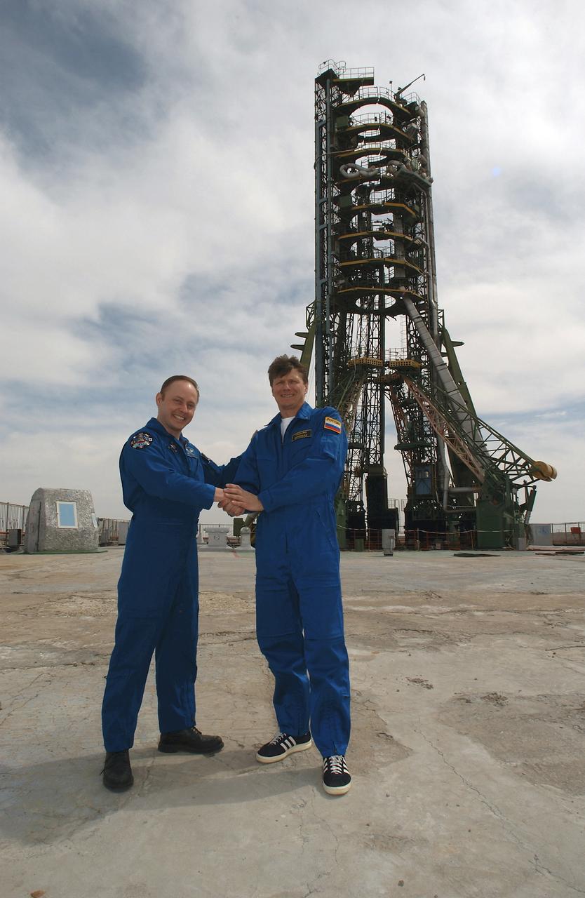 Flight Engineer and NASA Science Officer Mike Fincke, left and Expedition 9 Commander Gennady Padalka pose for a photo during a tour of the Soyuz launch pad, Wednesday, April 14, 2004, 2004 in Baikonur, Kazakhstan. Photo Credit: (NASA/Bill Ingalls)