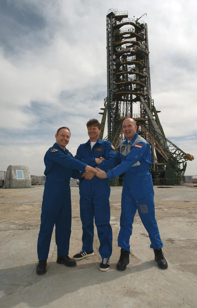 Flight Engineer and NASA Science Officer Mike Fincke, left, Expedition 9 Commander Gennady Padalka, center and European Space Agency astronaut Andre Kuipers of the Netherlands pose for a photo during a tour of the Soyuz launch pad, Wednesday, April 14, 2004, 2004 in Baikonur, Kazakhstan. Photo Credit: (NASA/Bill Ingalls)