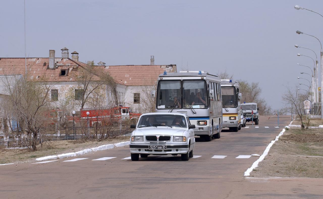 The Expedition 9 prime and backup crews are escorted through the Baikonur Cosmodrome on their way home to the Cosmonaut Hotel after a day of fit checks, pad visit and space museum tours, Wednesday, April, 14, 2004, in Baikonur, Kazakhstan. Photo Credit: (NASA/Bill Ingalls)