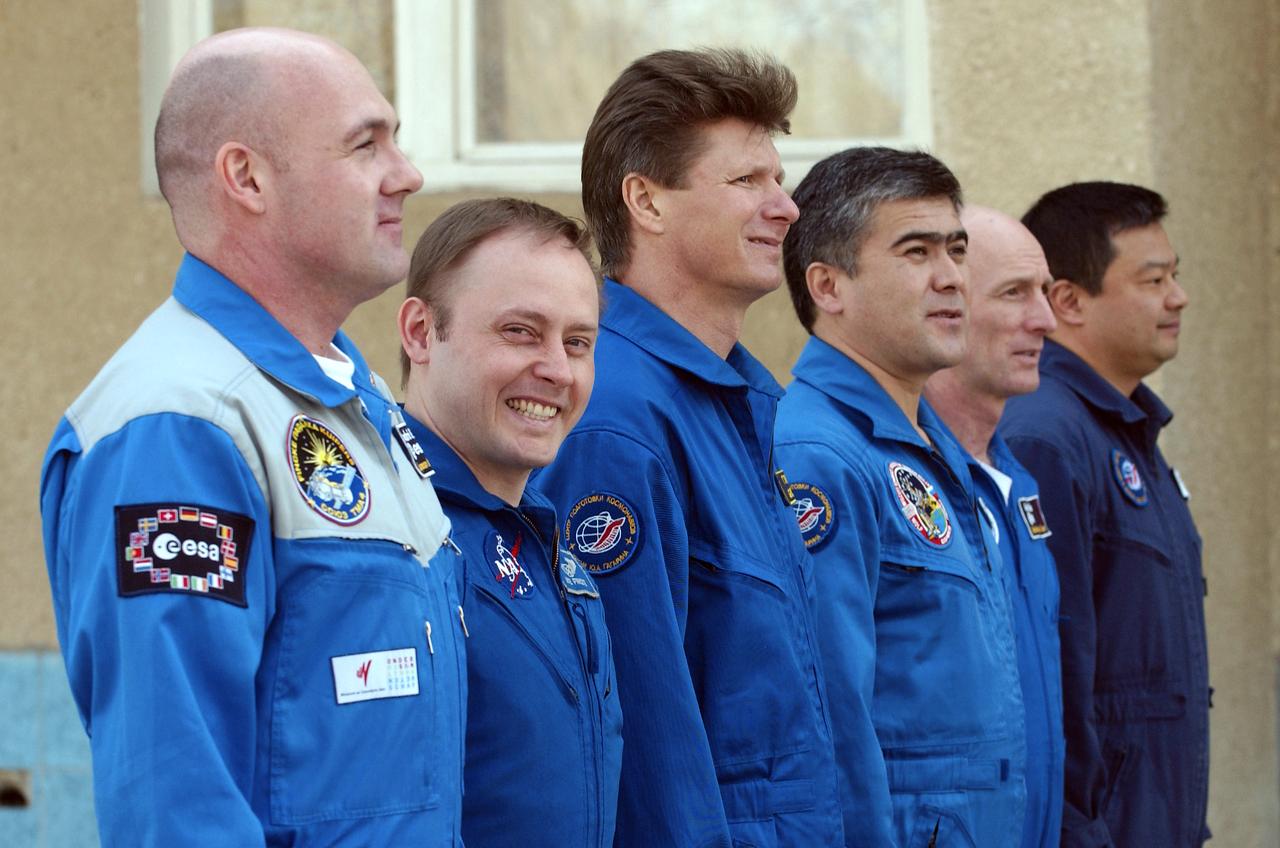 Left to Right: European Space Agency astronaut Andre Kuipers of the Netherlands, Expedition 9 Flight Engineer and NASA Science Officer Mike Fincke, Expedition 9 Commander Gennady Padalka, Backup Flight Engineer Salizhan Sharipov, backup European Space Agency astronaut Gerhard Thiele of Germany, NASA Expedition 9 backup Commander Leroy Chiao, prepare for the flag raising ceremony at the Cosmonaut Hotel, Thursday, April 15, 2004, in Baikonur, Kazakhstan. Photo Credit: (NASA/Bill Ingalls)