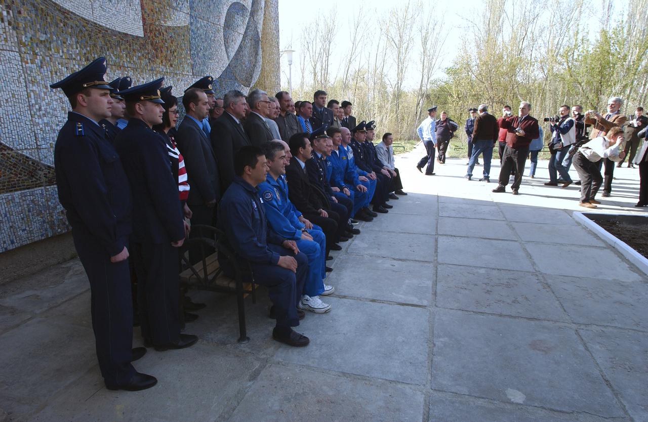 The prime and backup crews for Expedition 9 pose for a group photo after the flag raising ceremony at the Cosmonaut Hotel, Thursday, April 15, 2004, in Baikonur, Kazakhstan.  Photo Credit: (NASA/Bill Ingalls)