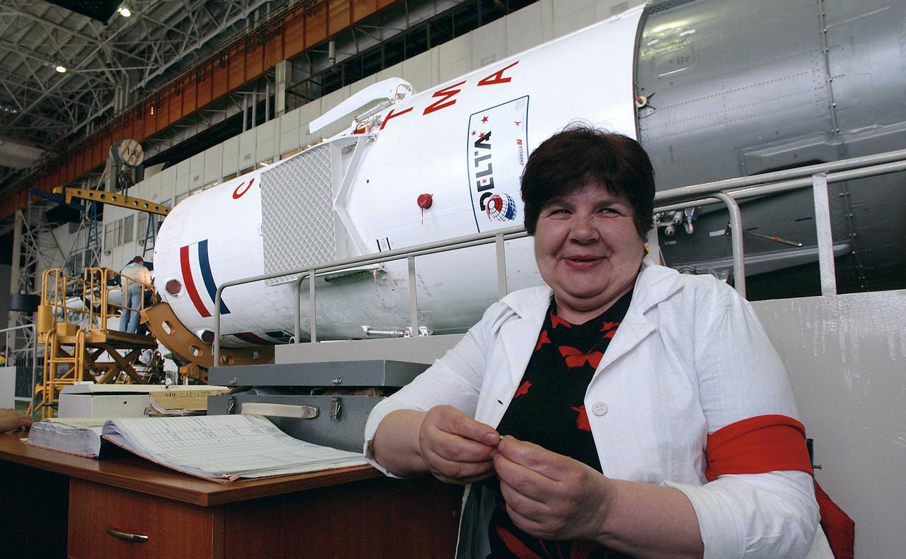 As engineers at the Baikonur Cosmodrome prepare to mate the Soyuz TMA-4 capsule with its booster rocket in preparation for a launch on April 19 of the Expedition 9 crew and a European astronaut to the International Space Station, a worker sits next to the book where technicians sign off after each step is completed of the Soyuz mating procedure, Friday, April 16, 2004 in Baikonur, Kazakhstan. Photo Credit: (NASA/Bill Ingalls)
