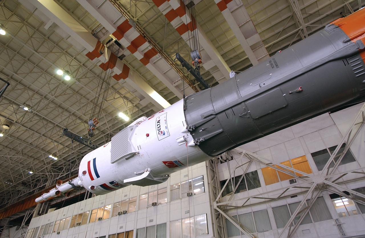 The Soyuz TMA-4 capsule is prepared for mating with its booster rocket at the Baikonur Cosmodrome in preparation for a launch on April 19 of the Expedition 9 crew and a European astronaut to the International Space Station, Friday, April 16, 2004 in Baikonur, Kazakhstan. Photo Credit: (NASA/Bill Ingalls)