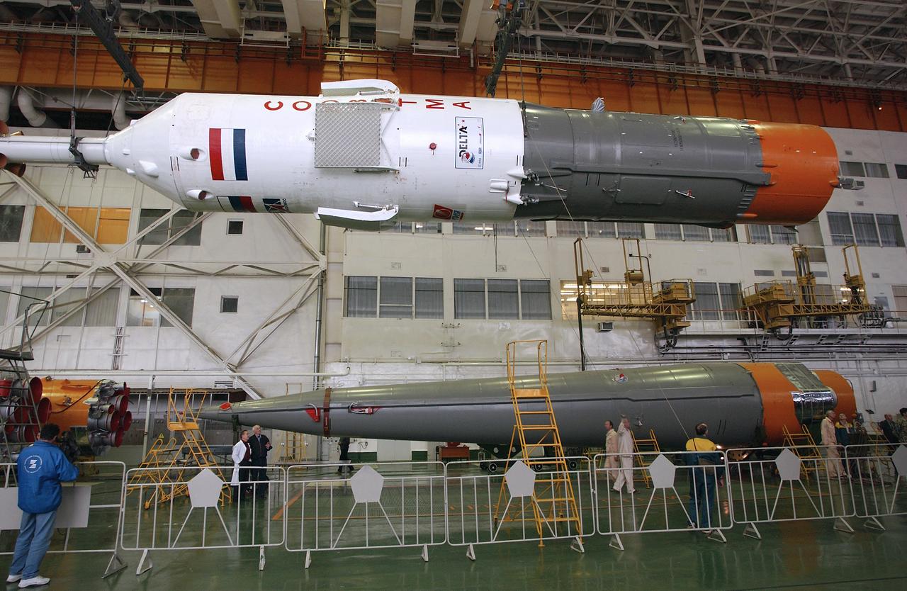 Engineers at the Baikonur Cosmodrome prepare to mate the Soyuz TMA-4 capsule with its booster rocket in preparation for a launch on April 19 of the Expedition 9 crew and a European astronaut to the International Space Station, Friday, April 16, 2004 in Baikonur, Kazakhstan. Photo Credit: (NASA/Bill Ingalls)