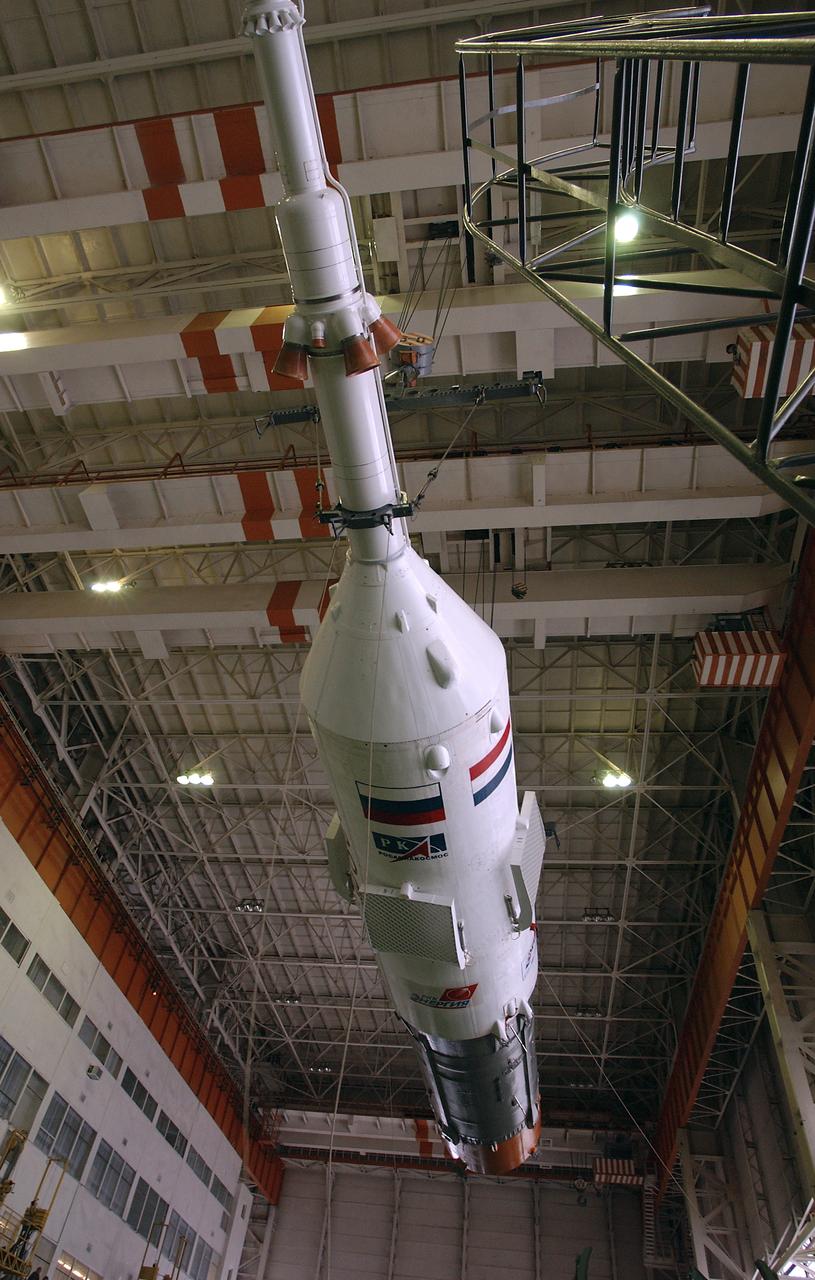 The Soyuz TMA-4 capsule is prepared for mating with its booster rocket at the Baikonur Cosmodrome in preparation for a launch on April 19 of the Expedition 9 crew and a European astronaut to the International Space Station, Friday, April 16, 2004 in Baikonur, Kazakhstan. Photo Credit: (NASA/Bill Ingalls)