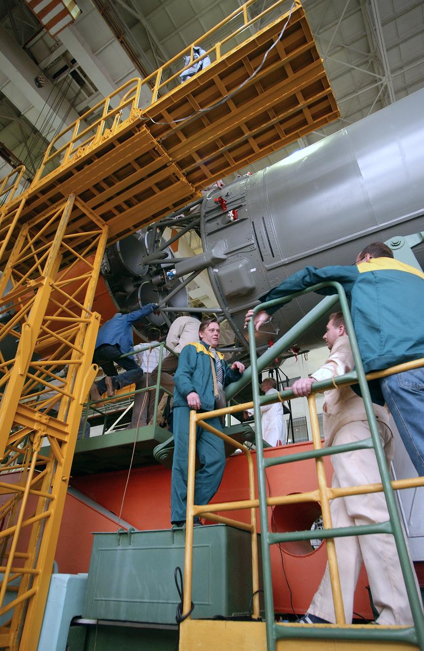 Engineers at the Baikonur Cosmodrome mate the Soyuz TMA-4 capsule with its booster rocket in preparation for a launch on April 19 of the Expedition 9 crew and a European astronaut to the International Space Station, Friday, April 16, 2004 in Baikonur, Kazakhstan. Photo Credit: (NASA/Bill Ingalls)