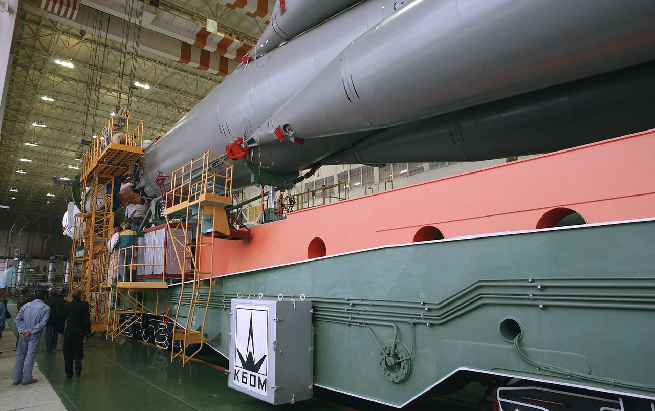 Engineers at the Baikonur Cosmodrome mate the Soyuz TMA-4 capsule with its booster rocket in preparation for a launch on April 19 of the Expedition 9 crew and a European astronaut to the International Space Station, Friday, April 16, 2004 in Baikonur, Kazakhstan. Photo Credit: (NASA/Bill Ingalls)