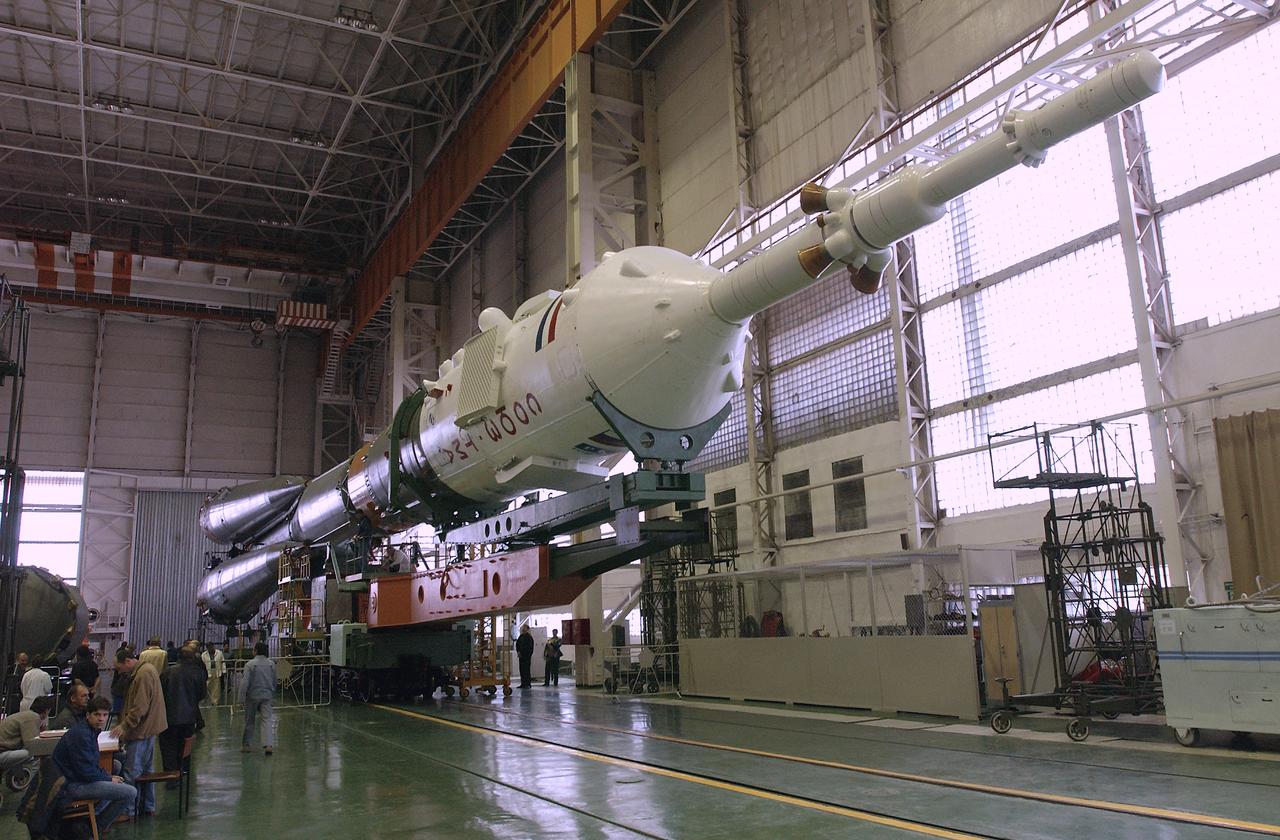 Engineers at the Baikonur Cosmodrome mated the Soyuz TMA-4 capsule with its booster rocket in preparation for a launch on April 19 of the Expedition 9 crew and a European astronaut to the International Space Station, Friday, April 16, 2004 in Baikonur, Kazakhstan. Photo Credit: (NASA/Bill Ingalls)