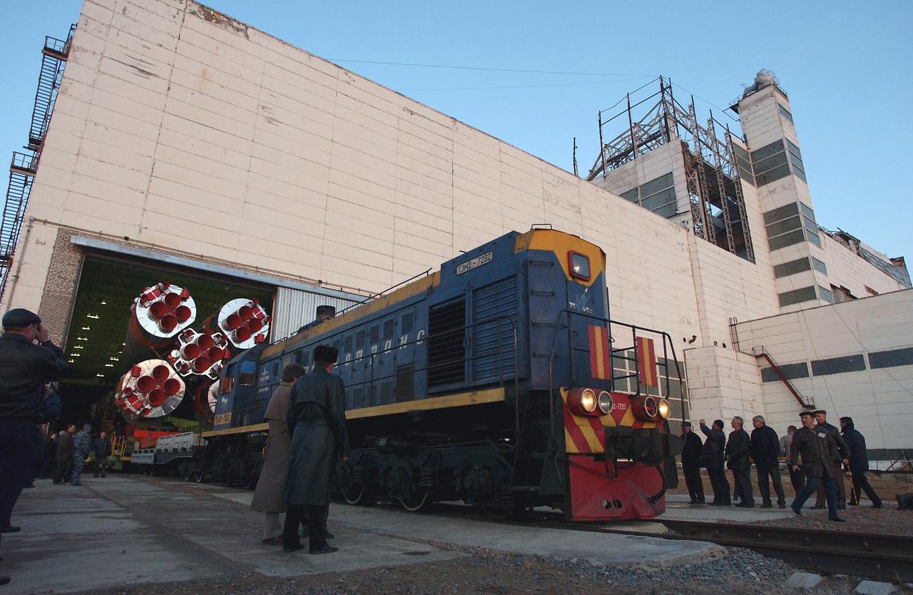 The Soyuz TMA-4 capsule and its booster rocket begin to roll to the launch pad at the Baikonur Cosmodrome on Saturday, April 17, 2004, in Baikonur, Kazakhstan in preparation for the launch of the Expedition 9 crew and a European researcher to the International Space Station on April 19. The Soyuz vehicle is transported to the launch pad horizontally on a railcar from its processing hangar in a process that takes about 2.5 hours to complete. Photo Credit: (NASA/Bill Ingalls)