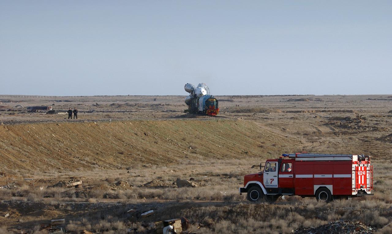 The Soyuz TMA-4 capsule and its booster rocket begin to roll to the launch pad at the Baikonur Cosmodrome on Saturday, April 17, 2004, in Baikonur, Kazakhstan in preparation for the launch of the Expedition 9 crew and a European researcher to the International Space Station on April 19. The Soyuz vehicle is transported to the launch pad horizontally on a railcar from its processing hangar in a process that takes about 2.5 hours to complete. Photo Credit: (NASA/Bill Ingalls)