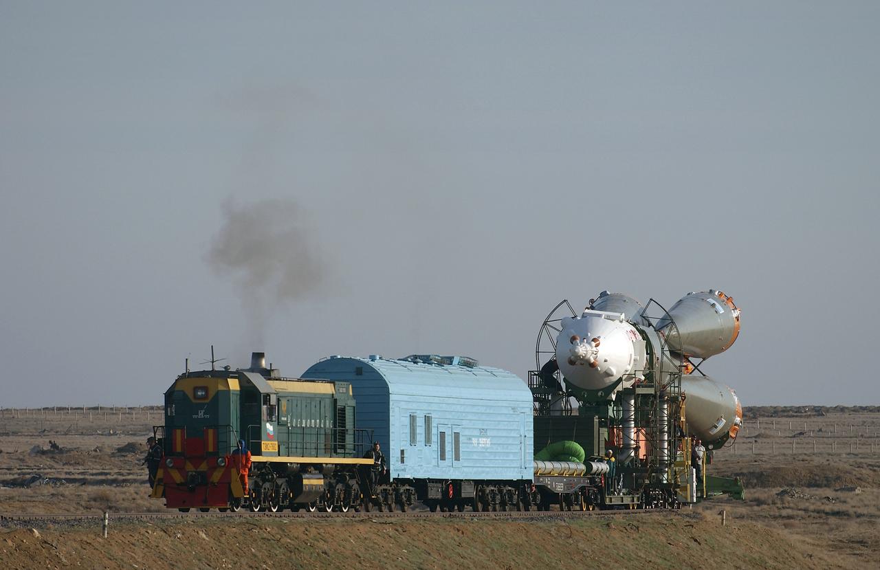 The Soyuz TMA-4 capsule and its booster rocket begin to roll to the launch pad at the Baikonur Cosmodrome on Saturday, April 17, 2004, in Baikonur, Kazakhstan in preparation for the launch of the Expedition 9 crew and a European researcher to the International Space Station on April 19. The Soyuz vehicle is transported to the launch pad horizontally on a railcar from its processing hangar in a process that takes about 2.5 hours to complete. Photo Credit: (NASA/Bill Ingalls)