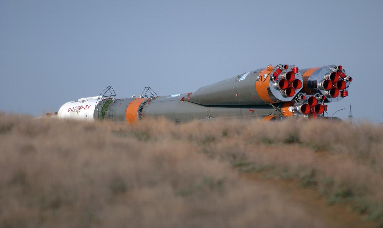 The Soyuz TMA-4 capsule and its booster rocket begin to roll to the launch pad at the Baikonur Cosmodrome on Saturday, April 17, 2004, in Baikonur, Kazakhstan in preparation for the launch of the Expedition 9 crew and a European researcher to the International Space Station on April 19. The Soyuz vehicle is transported to the launch pad horizontally on a railcar from its processing hangar in a process that takes about 2.5 hours to complete. Photo Credit: (NASA/Bill Ingalls)
