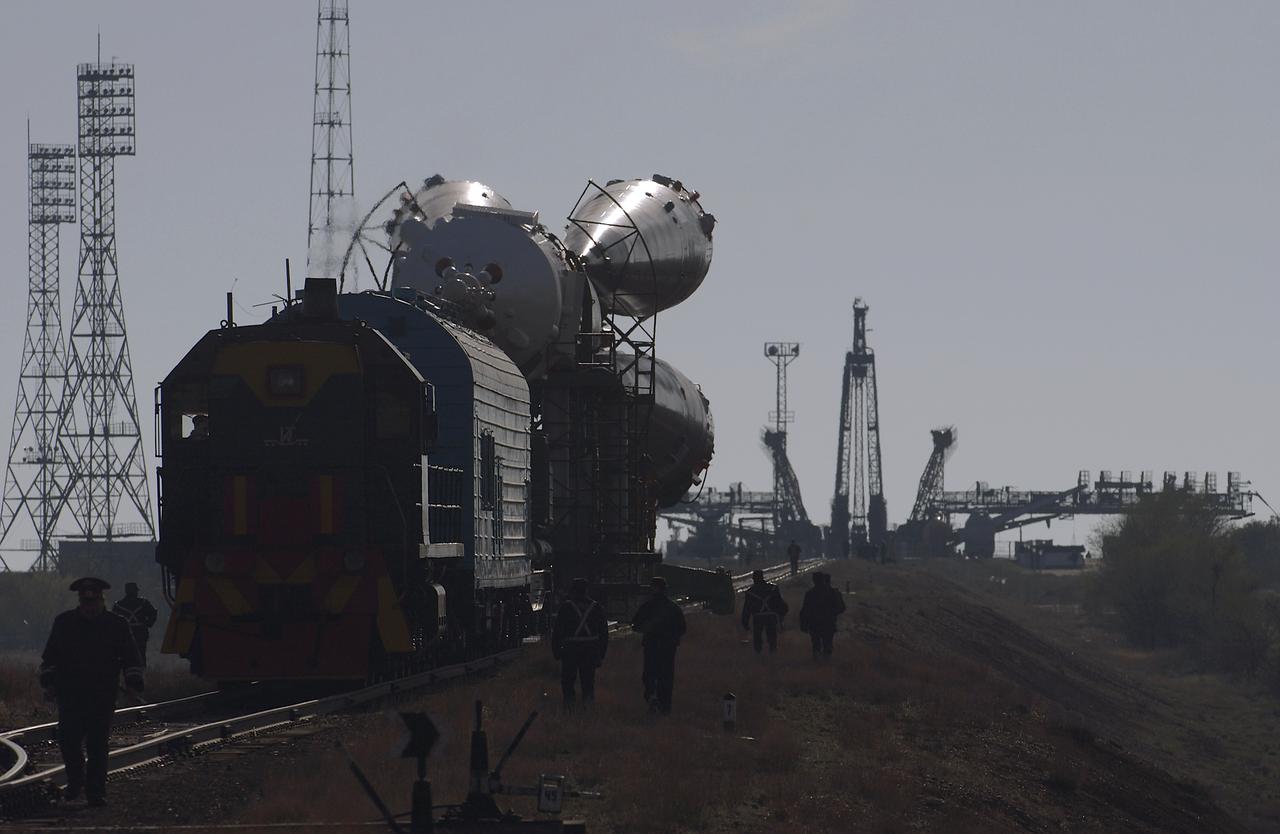 The Soyuz TMA-4 capsule and its booster rocket begin to roll to the launch pad at the Baikonur Cosmodrome on Saturday, April 17, 2004, in Baikonur, Kazakhstan in preparation for the launch of the Expedition 9 crew and a European researcher to the International Space Station on April 19. The Soyuz vehicle is transported to the launch pad horizontally on a railcar from its processing hangar in a process that takes about 2.5 hours to complete. Photo Credit: (NASA/Bill Ingalls)